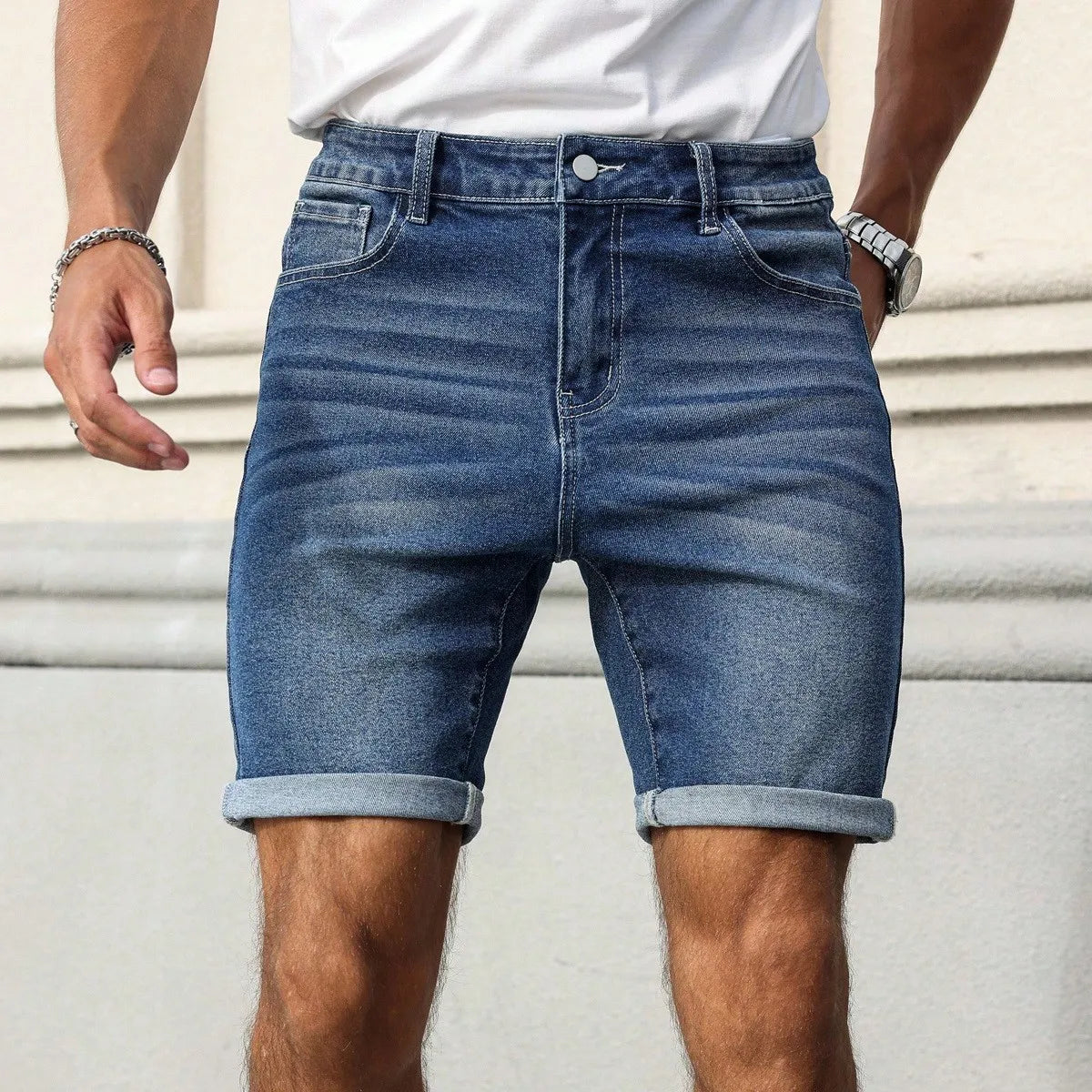 Men's Slim-Fit Blue Denim Shorts with Cuffed Hem, Blending Casual and Trendy Styles into a Versatile and Fashionable Piece